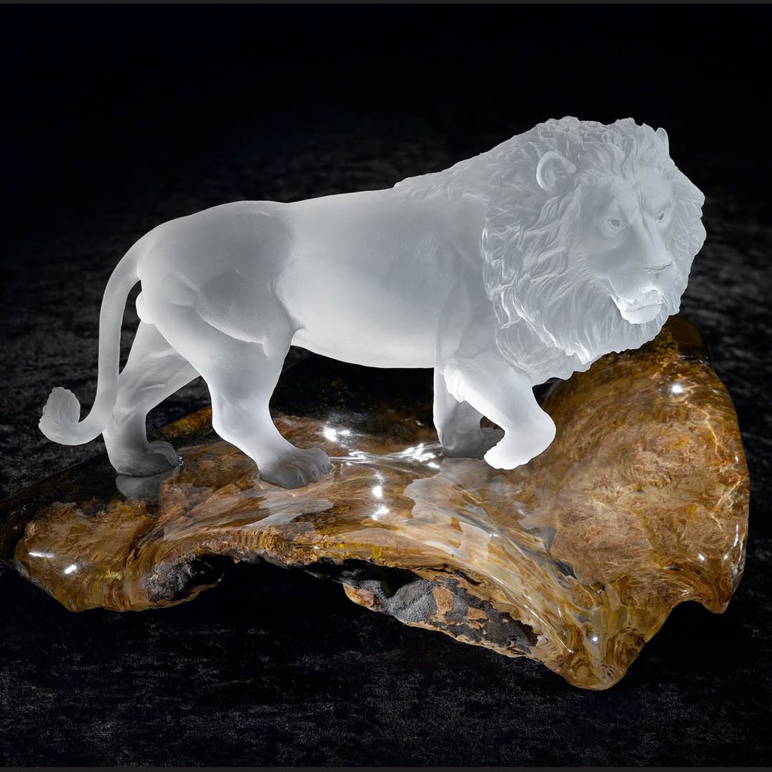 Rock crystal lion with base, hand-carved out of one natural piece of rock crystal – by Renée Newman